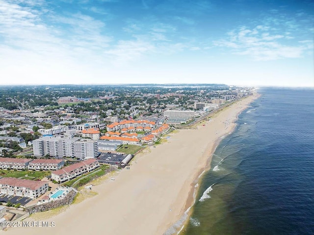 aerial view with a water view, a city view, and a view of the beach