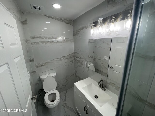 bathroom with visible vents, toilet, marble finish floor, vanity, and recessed lighting