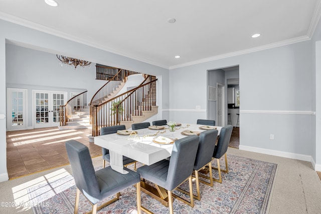 tiled dining area with ornamental molding, stairway, and baseboards