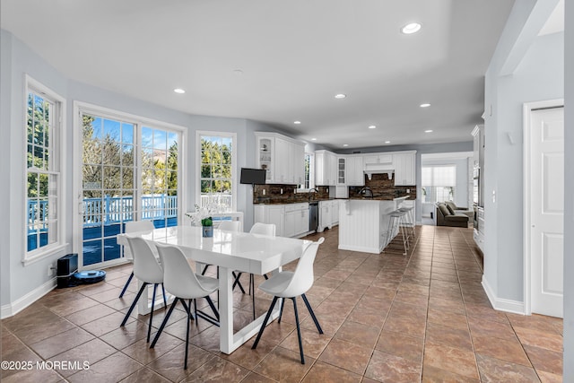 dining area featuring tile patterned floors, baseboards, and recessed lighting