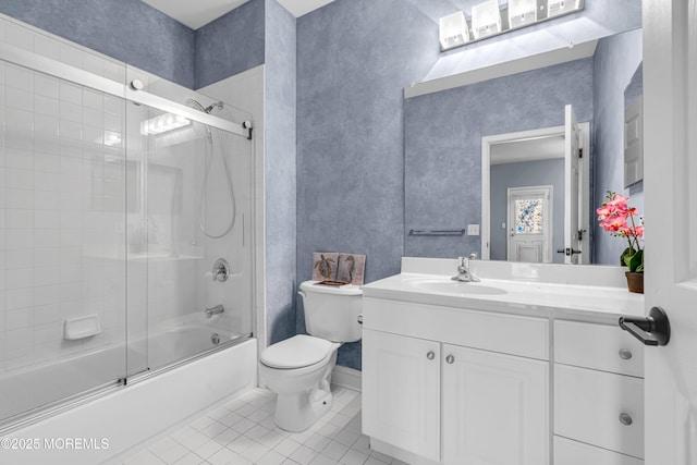 bathroom featuring vanity, bath / shower combo with glass door, tile patterned flooring, and toilet