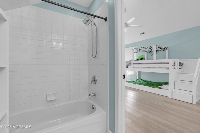 full bathroom featuring shower / bathing tub combination and wood finished floors