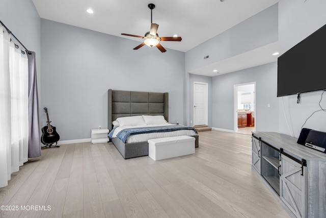 bedroom with light wood-style floors, baseboards, and recessed lighting