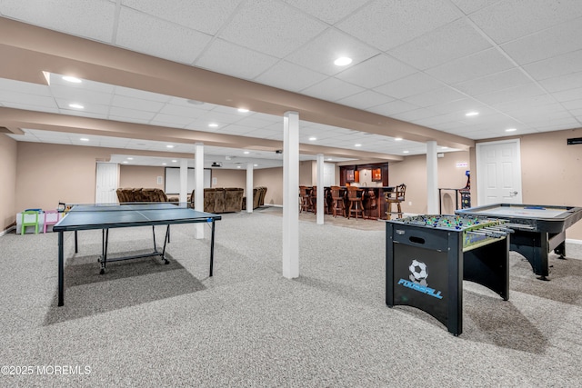 game room with a dry bar, baseboards, carpet flooring, and recessed lighting