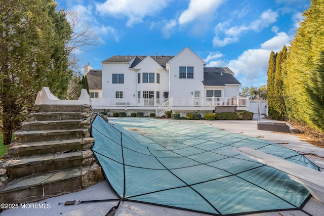 view of pool with a patio area and a covered pool