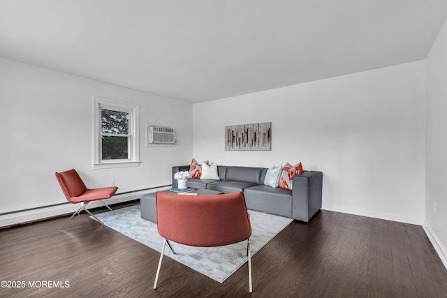 living area with dark wood-style floors, a wall mounted AC, baseboard heating, and baseboards