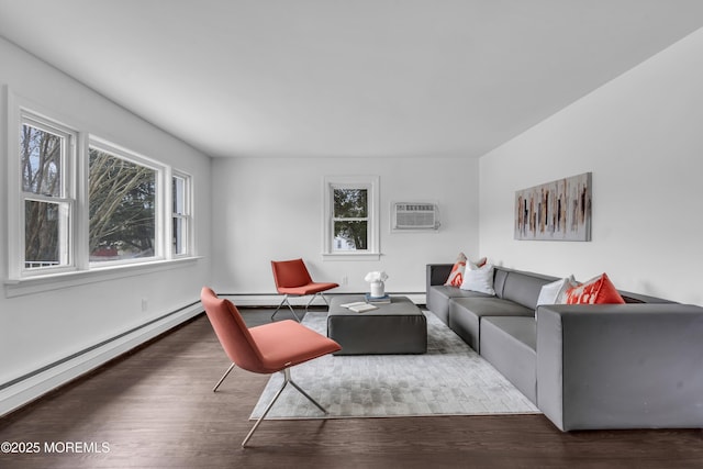 living room with a healthy amount of sunlight, a wall mounted air conditioner, dark wood finished floors, and baseboard heating