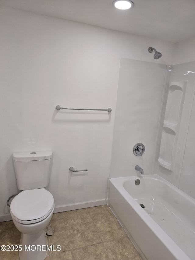 bathroom with shower / washtub combination, baseboards, and toilet