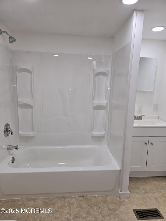 bathroom featuring vanity, shower / tub combination, and visible vents