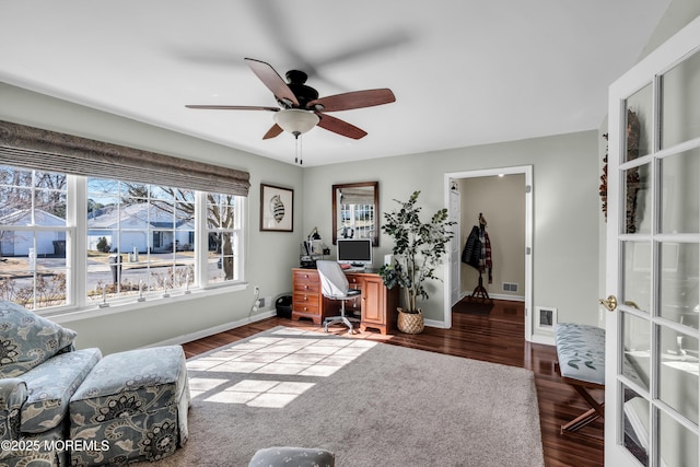 office space with ceiling fan, wood finished floors, visible vents, and baseboards