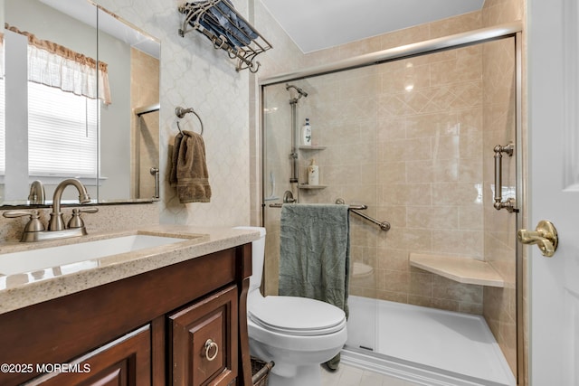 full bath with toilet, a shower stall, and vanity