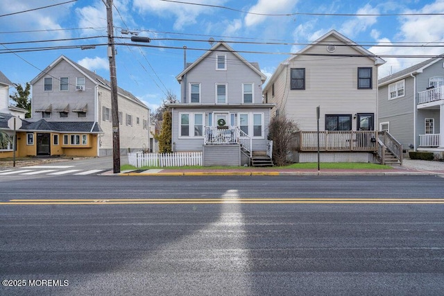 traditional-style home featuring fence and a residential view