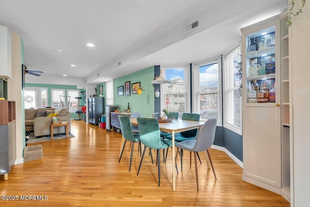 dining area featuring recessed lighting, baseboards, visible vents, and light wood finished floors