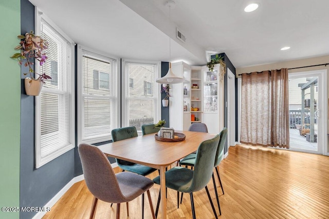 dining room with light wood-style flooring, visible vents, baseboards, and recessed lighting