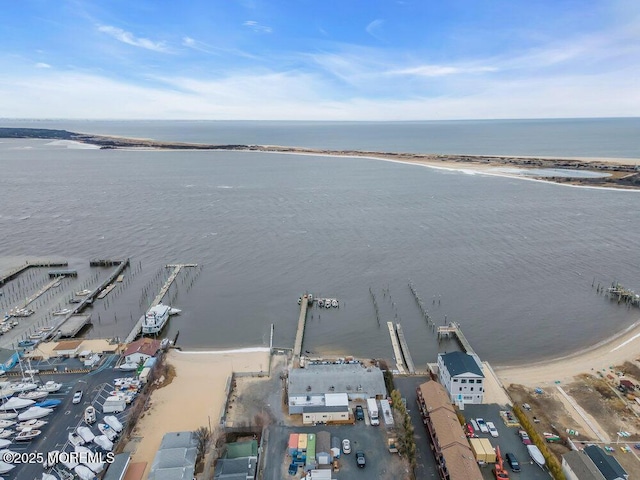 bird's eye view featuring a beach view and a water view