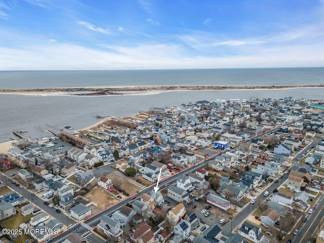 drone / aerial view featuring a water view and a residential view