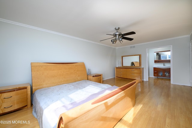 bedroom with visible vents, light wood-style floors, ornamental molding, a ceiling fan, and baseboards