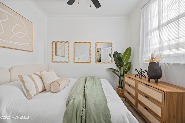 bedroom with ornamental molding and a ceiling fan