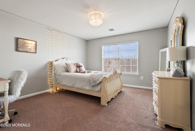 bedroom featuring baseboards, visible vents, and dark carpet