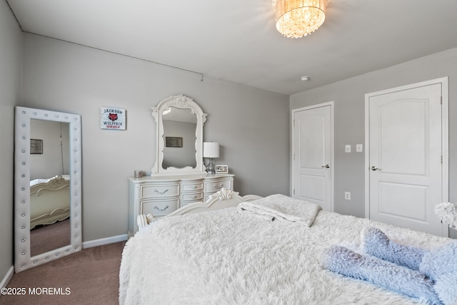 carpeted bedroom with baseboards