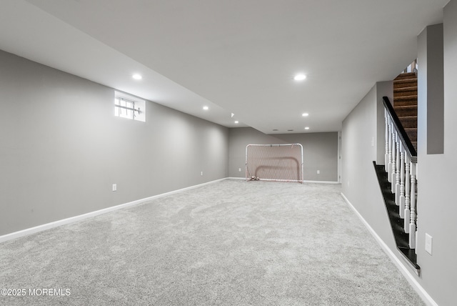 below grade area featuring stairs, carpet floors, baseboards, and recessed lighting