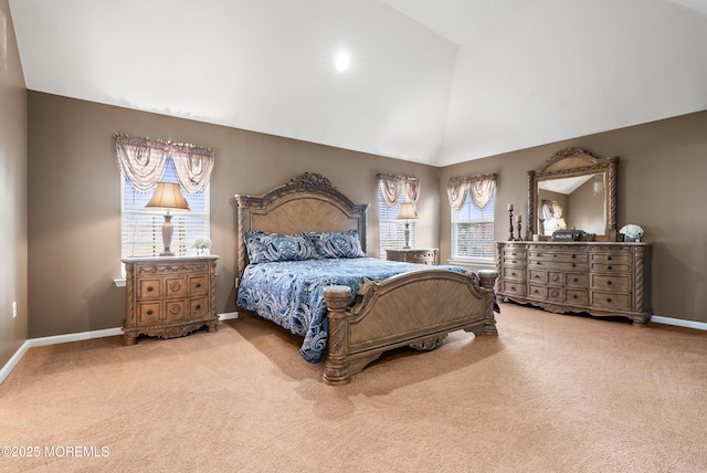 bedroom with high vaulted ceiling, carpet, and baseboards