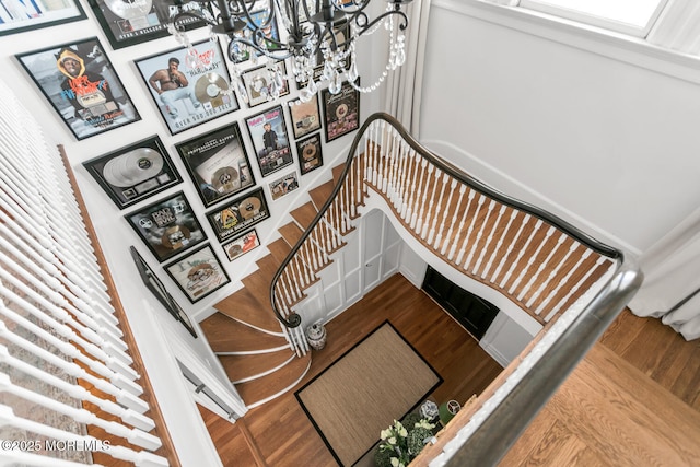 stairs featuring wood finished floors