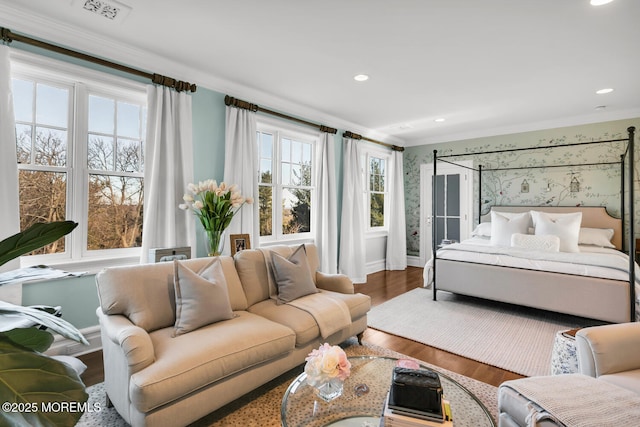 bedroom featuring ornamental molding, recessed lighting, visible vents, and wood finished floors