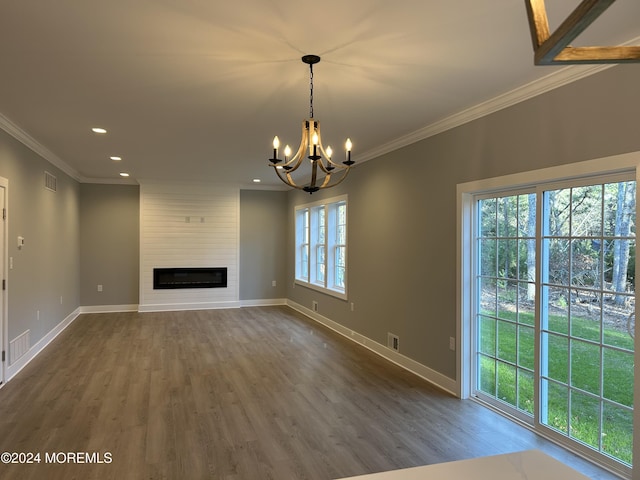 unfurnished living room with dark wood-style floors, crown molding, a fireplace, visible vents, and baseboards