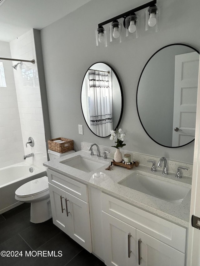 full bathroom featuring toilet, shower / bathtub combination, a sink, and tile patterned floors