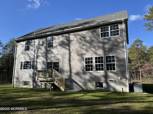 back of house featuring a yard