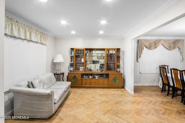 sitting room featuring recessed lighting, crown molding, and baseboards