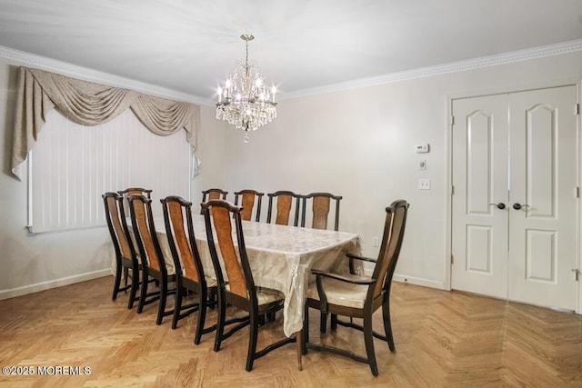 dining space featuring a notable chandelier, ornamental molding, and baseboards