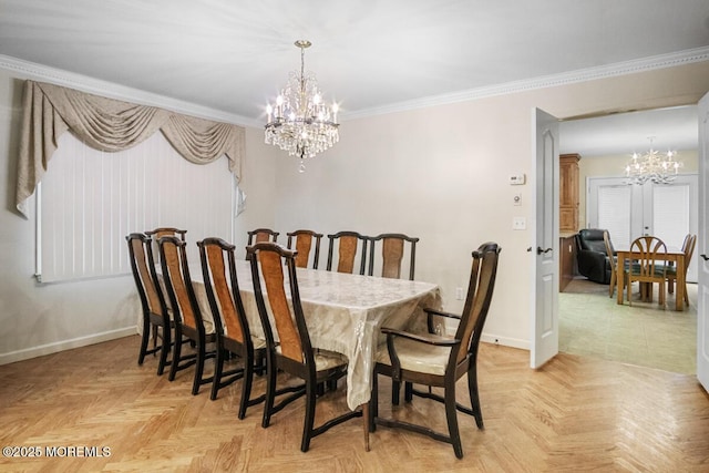 dining room with a chandelier, baseboards, and crown molding