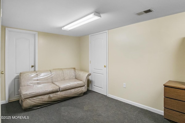 sitting room featuring carpet floors, visible vents, and baseboards