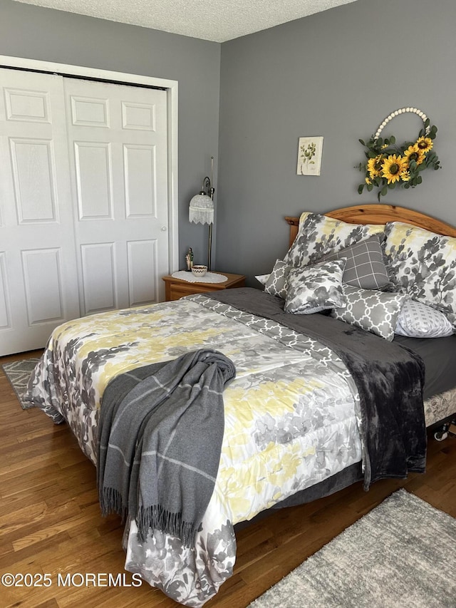 2 Apache Dr, Toms River, NJ 08753 - bedroom with a closet, wood finished floors, and a textured ceiling