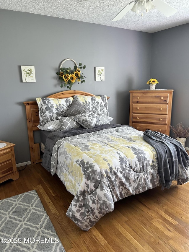 2 Apache Dr, Toms River, NJ 08753 - bedroom with a ceiling fan, a textured ceiling, and wood finished floors