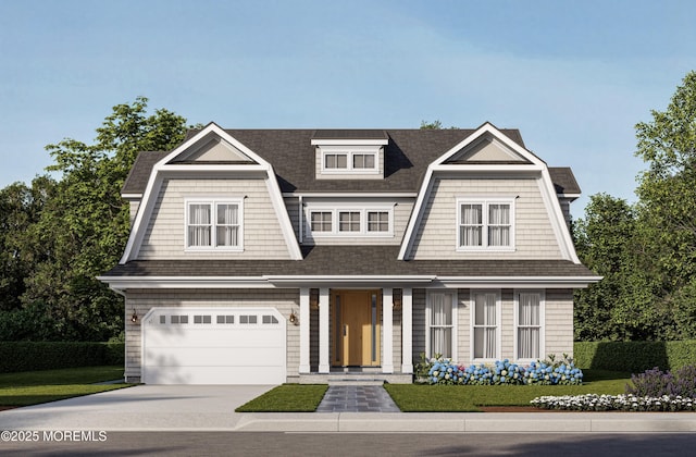 shingle-style home with driveway, a front lawn, an attached garage, and a gambrel roof