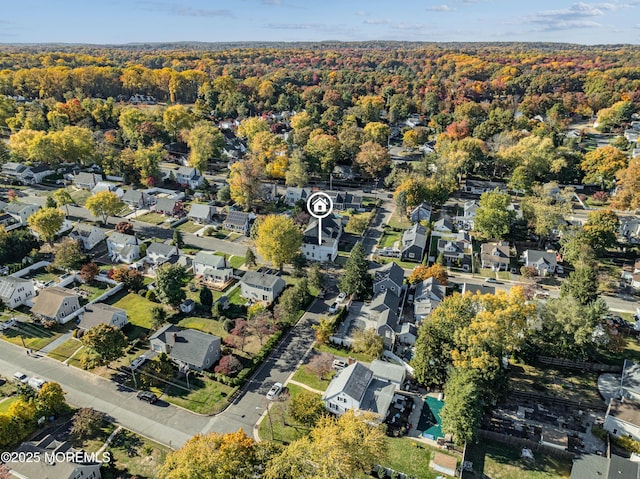 aerial view with a residential view and a view of trees