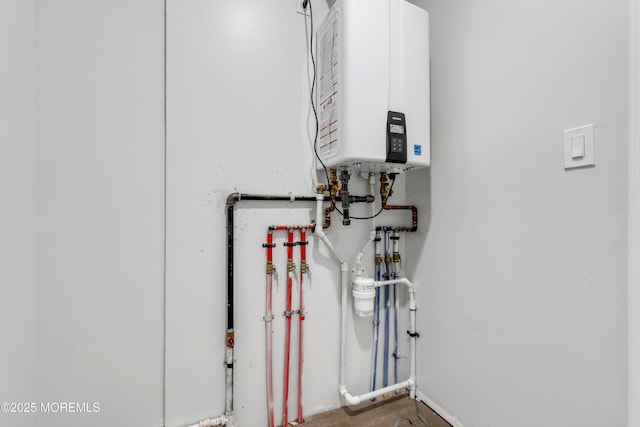 utility room with water heater