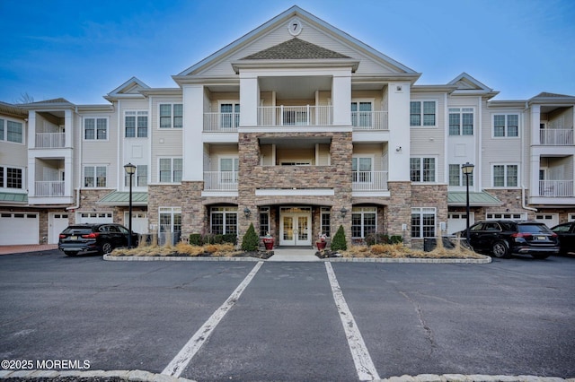 view of building exterior with uncovered parking