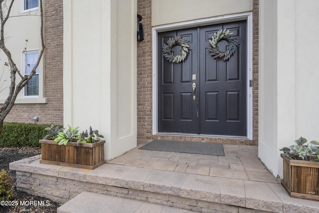 doorway to property with stucco siding