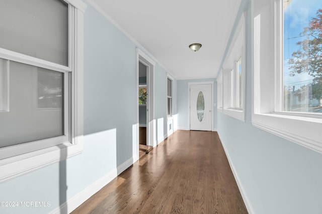 138 Summit Ave, Neptune City, NJ 07753 - corridor featuring baseboards, ornamental molding, wood finished floors, and a wealth of natural light