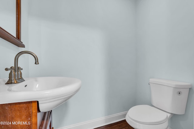 138 Summit Ave, Neptune City, NJ 07753 - bathroom featuring a sink, baseboards, toilet, and wood finished floors