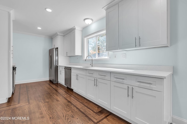 138 Summit Ave, Neptune City, NJ 07753 - kitchen with appliances with stainless steel finishes, a sink, baseboards, light countertops, and white cabinetry