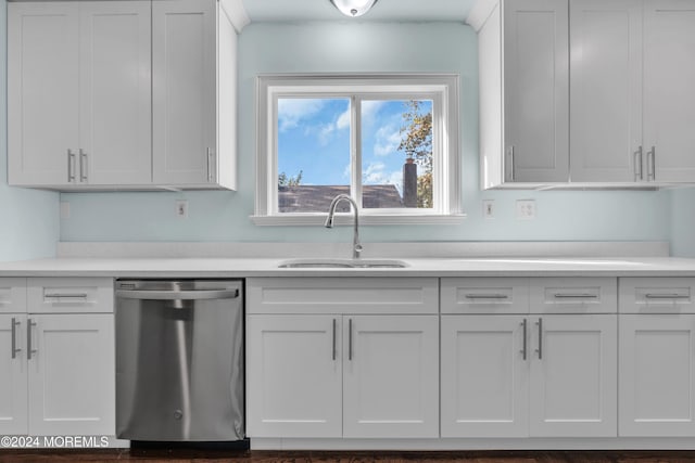 138 Summit Ave, Neptune City, NJ 07753 - kitchen with stainless steel dishwasher, white cabinets, a sink, and light countertops