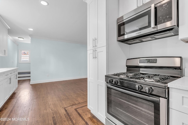 138 Summit Ave, Neptune City, NJ 07753 - kitchen featuring dark wood-style flooring, appliances with stainless steel finishes, light countertops, ornamental molding, and white cabinetry