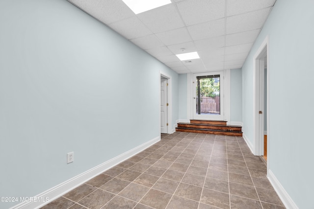 138 Summit Ave, Neptune City, NJ 07753 - tiled empty room featuring baseboards and a paneled ceiling