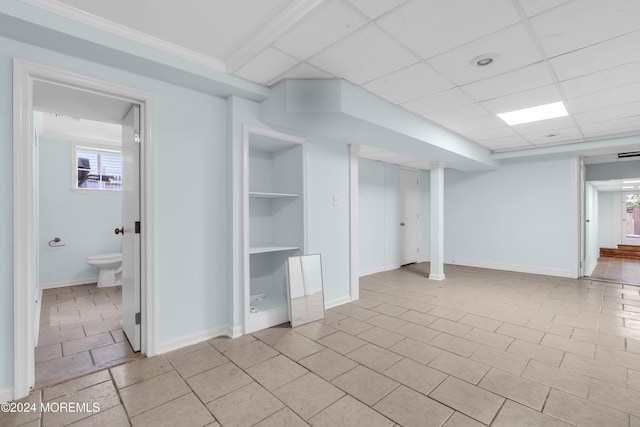 138 Summit Ave, Neptune City, NJ 07753 - basement featuring baseboards, light tile patterned floors, and built in shelves