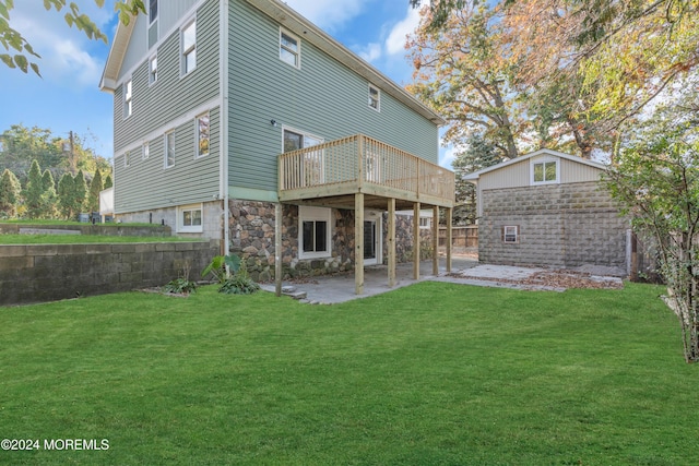 138 Summit Ave, Neptune City, NJ 07753 - back of property with a lawn, an outbuilding, a patio area, and stone siding